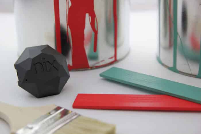 Nix Device sitting alongside some painting materials