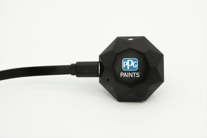 The PPG Mini has its charging cable plugged in